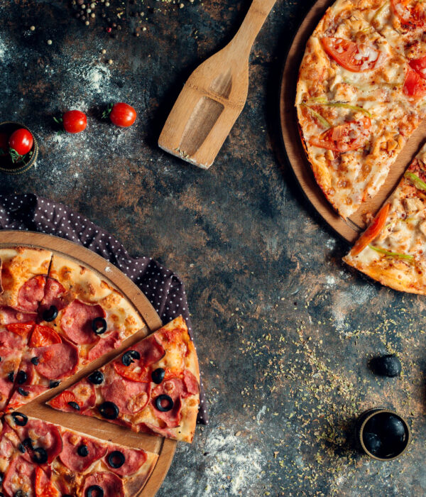 a pair of mixed piiza on the table
